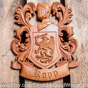 May include: A wooden coat of arms plaque with intricate carvings. The shield features a mythical creature and the name "Kopy" is inscribed below.