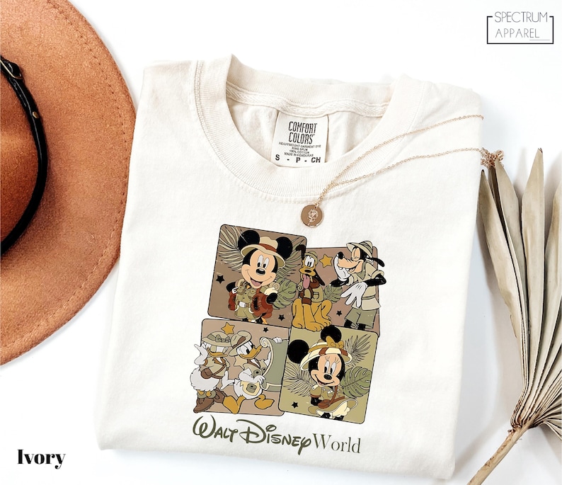 a white shirt with a mickey mouse picture on it