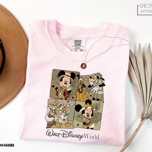 a pink tshirt with a picture of mickey mouse on it