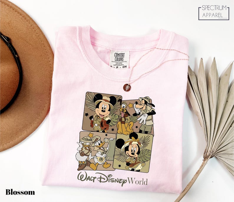 a pink tshirt with a picture of mickey mouse on it