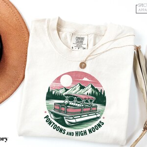 a hat, sunglasses, and a t - shirt with a picture of a truck