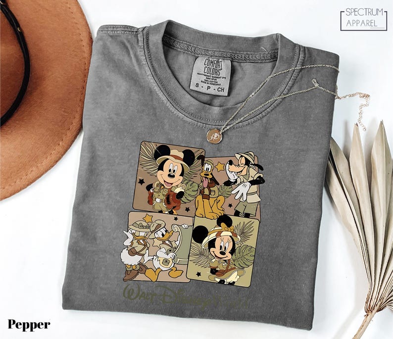 a gray shirt with mickey mouses on it