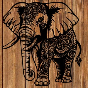 May include: Black and white silhouette of an elephant with intricate floral patterns on its body. The elephant is standing with its trunk raised and its ears spread out.