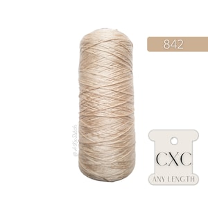 May include: A spool of beige embroidery floss with the text "CXC ANY LENGTH" and the number "842" on a white label.