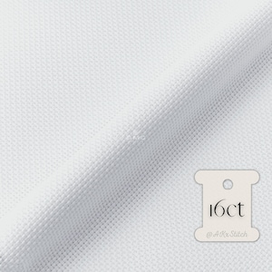 May include: White Aida cloth with a white label that says "16ct @AKxStitch".