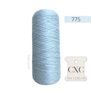 May include: A spool of light blue thread with the text "CXC ANY LENGTH" and the number "775" on a white label.