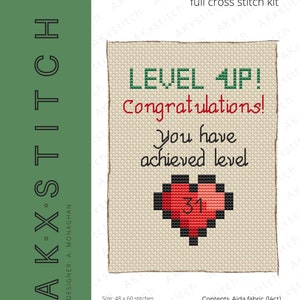 May include: A cross stitch pattern for a card that says "Level Up! Congratulations! You have achieved level 31." The card features a pixelated heart with the number 31 inside. The pattern is 48 stitches wide by 60 stitches high, or 8.7 cm by 10.9 cm.