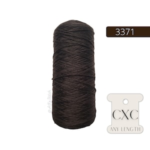 May include: A spool of dark brown embroidery floss with the text "CXC ANY LENGTH" and the number "3371" on a white label.