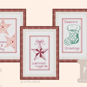 May include: Three framed cross-stitch patterns with red and green thread. The first pattern features two red stars with the text "Peace & Joy". The second pattern features a red star with a bow and the text "Warmest regards". The third pattern features a green stocking with the text "Season's Greetings".