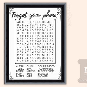 May include: A framed black and white word search puzzle with the text "Forgot your phone?" at the top. The puzzle contains bathroom-related words. The bottom of the frame has a list of words to find. The words are in a decorative font.