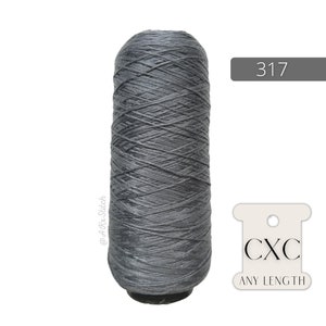 May include: A spool of gray thread with the number 317 printed on a label. The label also says "CXC ANY LENGTH".