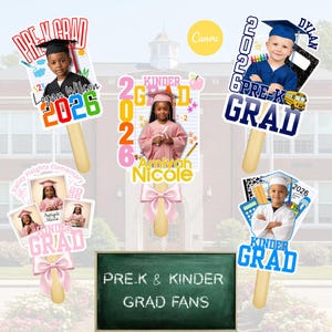 May include: Graduation photo props on wooden sticks. The props feature photos of children in graduation attire, with text that reads "Pre-K Grad," "Kinder Grad," and the year "2026." A chalkboard sign reads "Pre-K & Kinder Grad Fans."