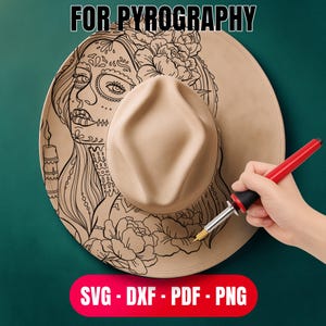 May include: A tan fedora hat with a detailed black line art design of a woman's face and floral elements. The text "FOR PYROGRAPHY" is at the top. The bottom has the text "SVG - DXF - PDF - PNG". A hand holds a wood-burning tool.