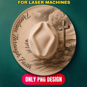 May include: A beige cowboy hat with the words "Freedom Through Faith" in a script font. The hat features a detailed graphic of a cross on a hill, a landscape, and a cloudy sky. The text "FOR LASER MACHINES" and "ONLY PNG DESIGN" are also present.