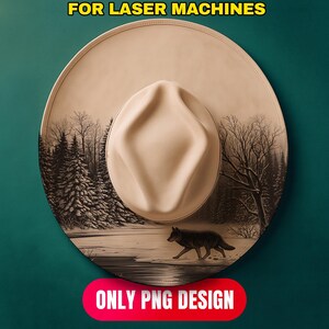 May include: A tan cowboy hat with a detailed forest and wolf design. The hat features a light-colored crown and brim, with a black and white forest scene and a wolf walking across a snowy landscape. Text at the top says "FOR LASER MACHINES" and at the bottom "ONLY PNG DESIGN".