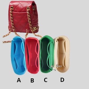 May include: Four different colored felt bag organizers with multiple compartments. The organizers are labeled A, B, C, and D.