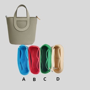 May include: Four felt bag organisers in different colours: light blue, red, green, and beige. The organisers have multiple compartments and are designed to fit inside a larger bag.