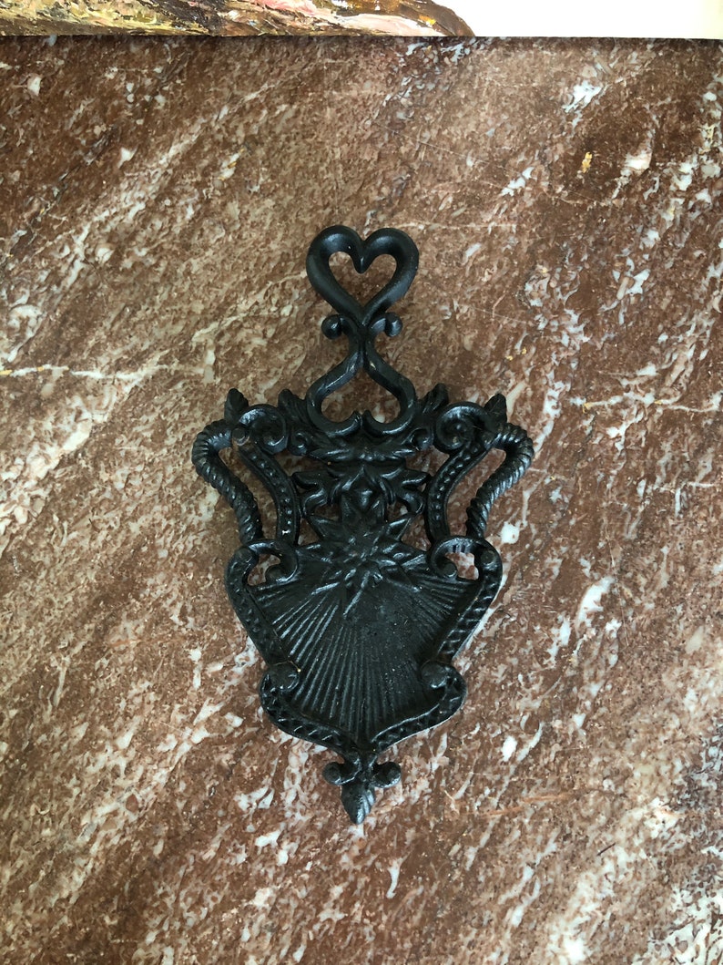 Vintage heavy wrought iron trivet hearts design