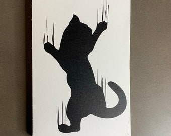 Cat scratching softcover blank book
