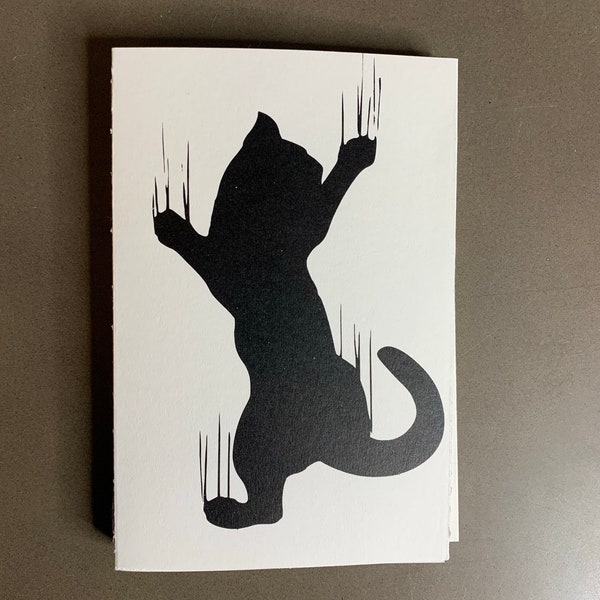 Cat scratching softcover blank book