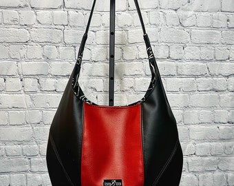 Handcrafted, color blocked, faux leather spacious shoulder bag