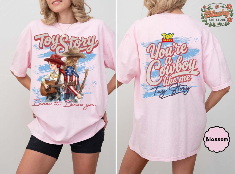May include: A light pink t-shirt featuring a front graphic of two figures in cowboy hats playing guitars with the text Toy Story and I knew it, I know you. The back displays the text Toy Story, You're a Cowboy like me, and Tay Story.