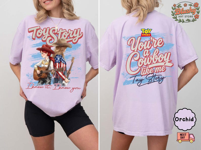 May include: A light purple t-shirt featuring a graphic print on the front and back. The front shows two figures with guitars and the text Toy Story and I knew it. I know you. The back displays the text Toy Story, You're a Cowboy like me, and Tay Story.