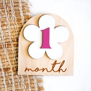 1 month wooden baby milestone marker with white flower and pink number one