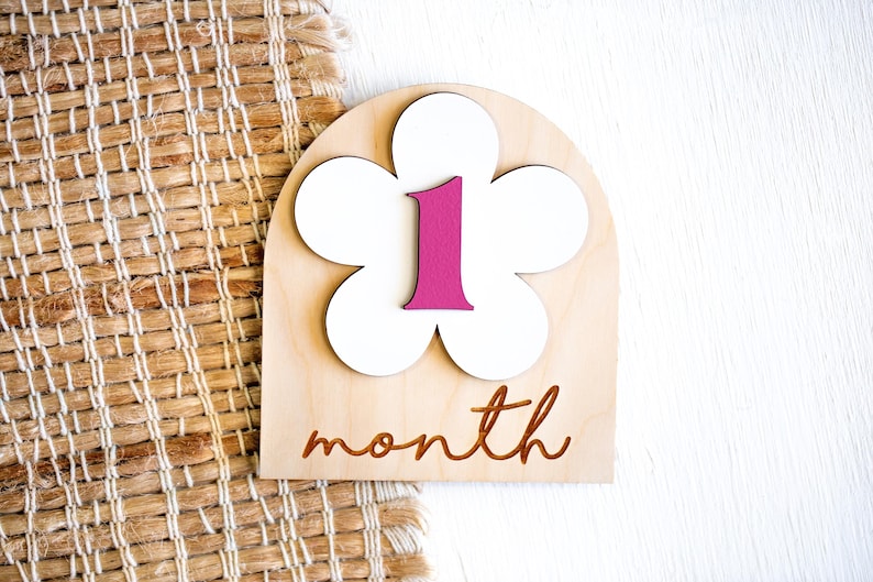 1 month wooden baby milestone marker with white flower and pink number one