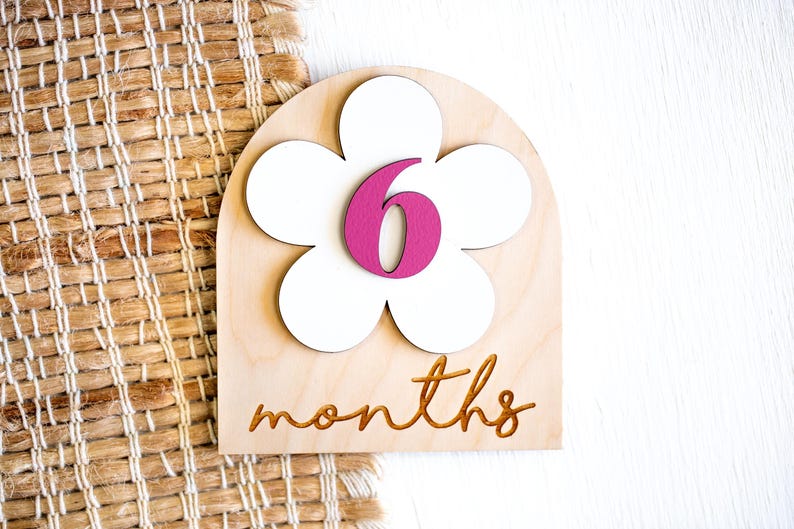 6 month baby milestone marker with white flower and pink number