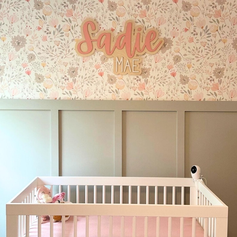 pink and white wooden nursery name sign with custom name