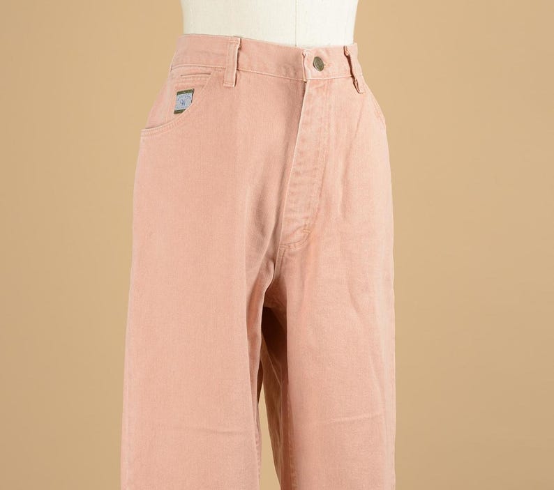 May include: A pair of light pink, high-waisted, straight-leg jeans.