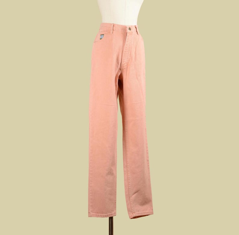May include: A pair of light pink pants with a straight leg fit.