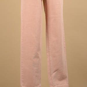 May include: A pair of light pink pants with a straight leg fit.