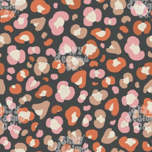 May include: A seamless pattern featuring a dark charcoal gray background with an abstract leopard print design. The spots are composed of irregular shapes in shades of dusty pink, burnt orange, beige, and cream, creating a repeating graphic motif.