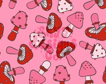 Puede incluir: Un patrón sin costuras con setas rojas y rosas con corazones y estrellas sobre un fondo rosa. Las setas tienen tallos blancos y tapas con volantes.