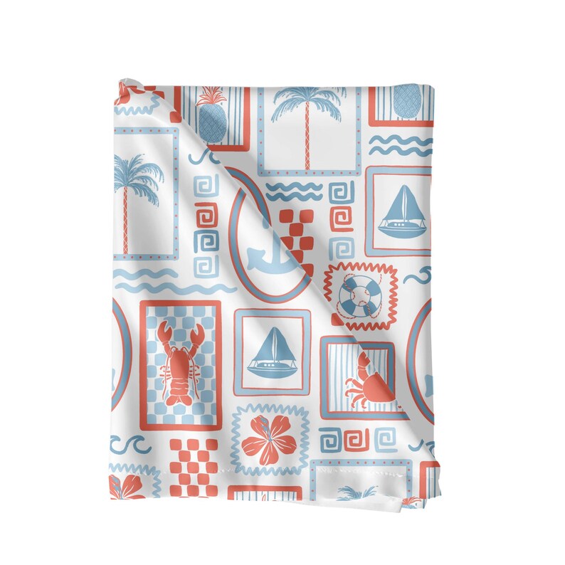 May include: A white fabric with a repeating pattern of blue and red nautical themed illustrations. The pattern includes anchors, sailboats, pineapples, crabs, and life preservers.