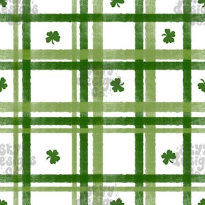 Pode incluir: Um padrão sem costura com um fundo xadrez verde e desenhos de trevos dispersos. O xadrez é composto por listras verdes e verde claro alternadas.