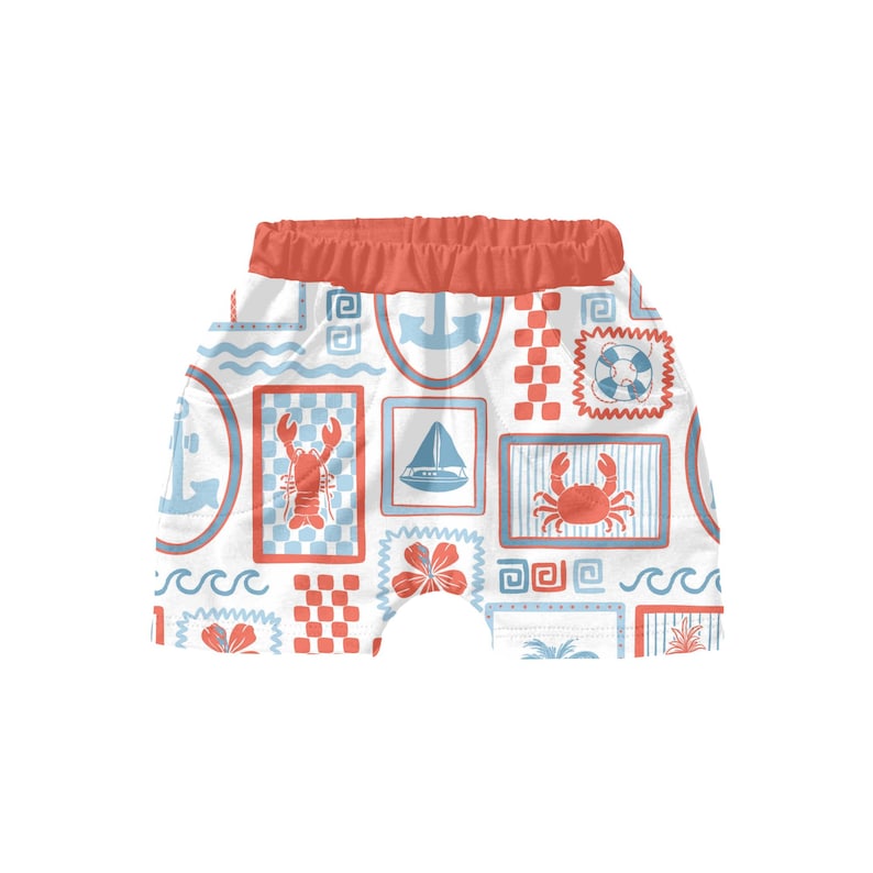 May include: White and red patterned shorts with a nautical theme. The pattern includes anchors, sailboats, crabs, lobsters, and life preservers.