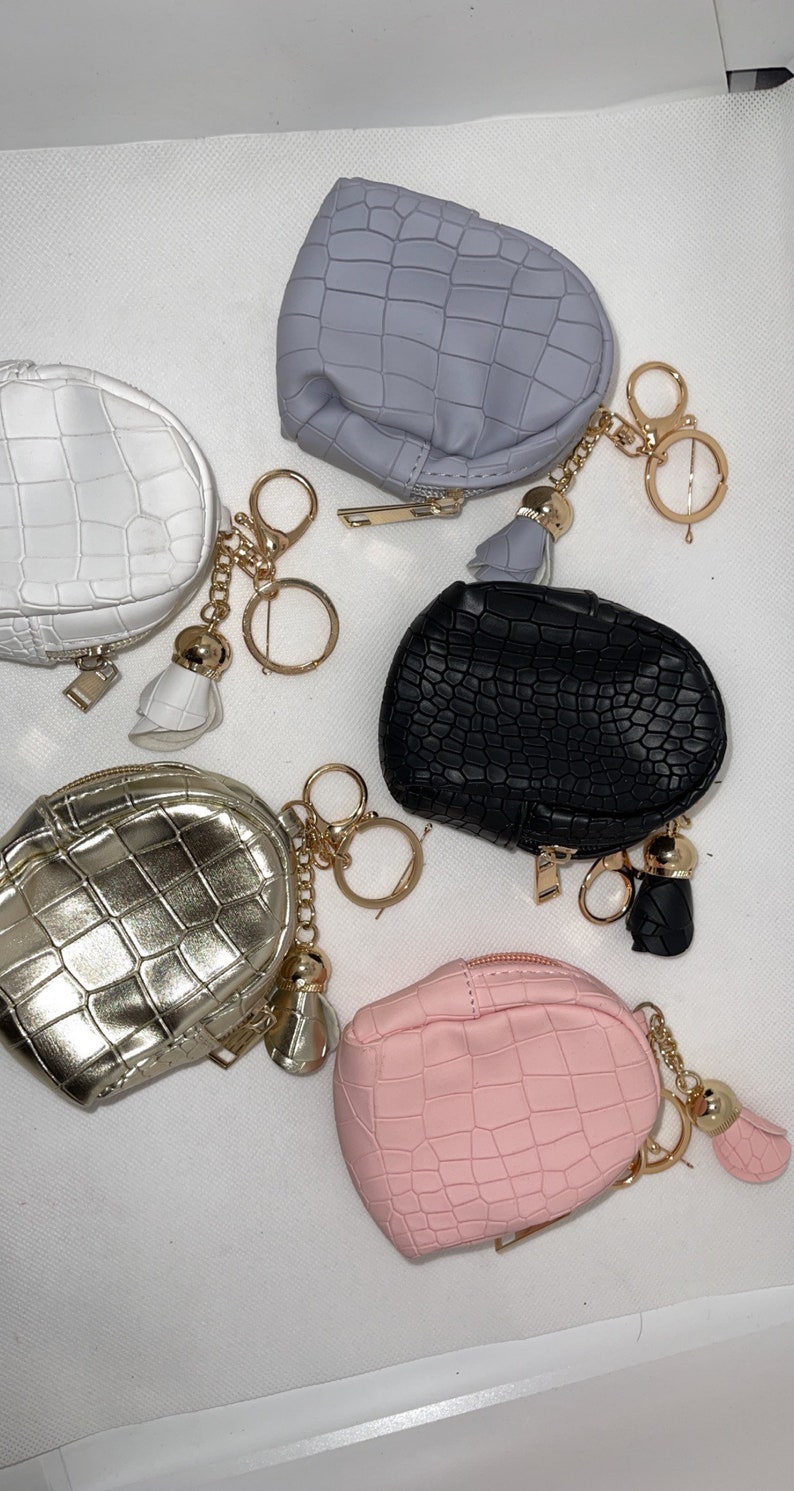 hand sanitizer and chapstick can be used as a coin bag Comes with keychain holder mask holder Small backpack