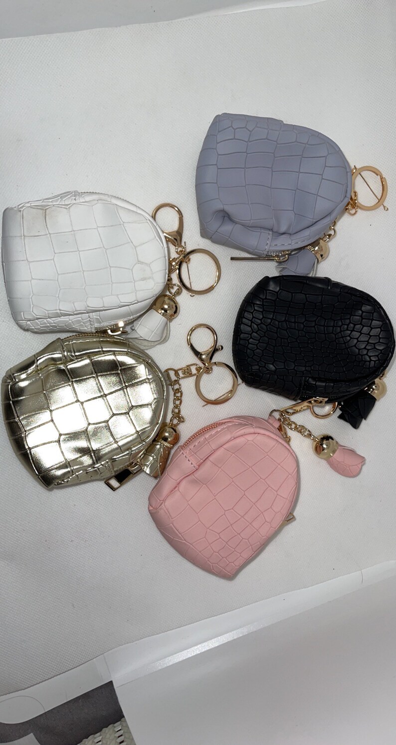 hand sanitizer and chapstick can be used as a coin bag Comes with keychain holder mask holder Small backpack