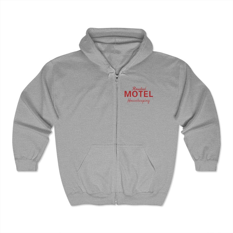 May include: A gray zip-up hoodie with a red embroidered logo that says "Rosebud Motel Housekeeping".