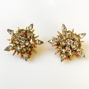 Pendientes de clip con forma de estrella y rayos de sol en tono dorado de Hobe vintage con diamantes de imitación transparentes
