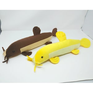 Two loaches: one brown wild loach and one golden loach plush fish animal