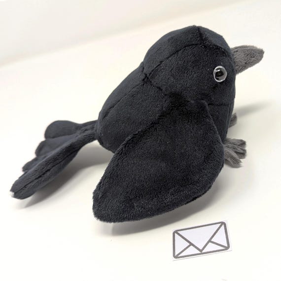 Pájaro cuervo de peluche con una ala y bolsillo, regalo de animal de peluche