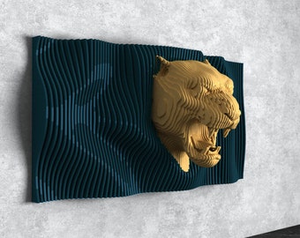 May include: A gold-colored, 3D, layered, wooden sculpture of a roaring panther head mounted on a dark blue, wavy, layered, wooden background.