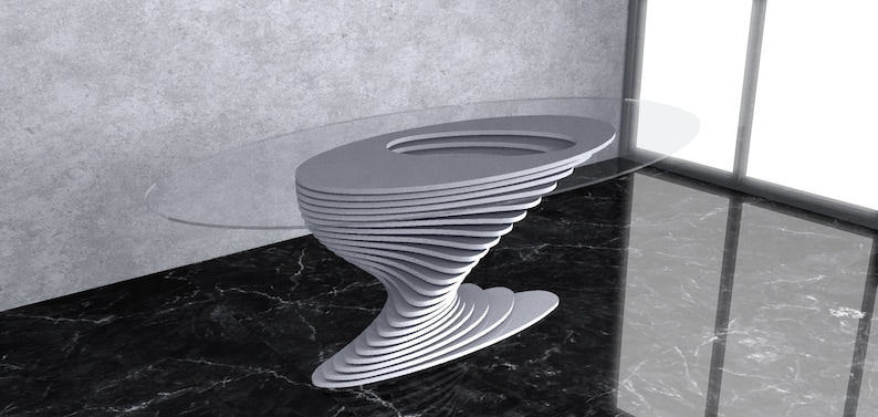 May include: A modern, oval glass-top table with a unique, layered, white base that resembles a swirling vortex. The table is on a black marble floor.