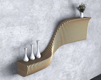 May include: A wooden wall shelf with a curved design and multiple levels. The shelf is decorated with white vases and a small bouquet of flowers.