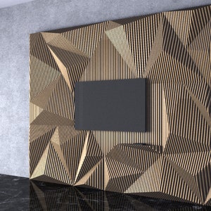 May include: A modern, geometric wall panel made of wood slats. The panel features a textured, abstract design with a rectangular cutout for a television. The panel is a light brown colour and is mounted on a grey wall.