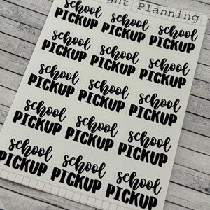 May include: A sheet of stickers with the text "Midnight Planning" at the top. The sheet contains nine stickers with the text "school pickup" in black cursive lettering.